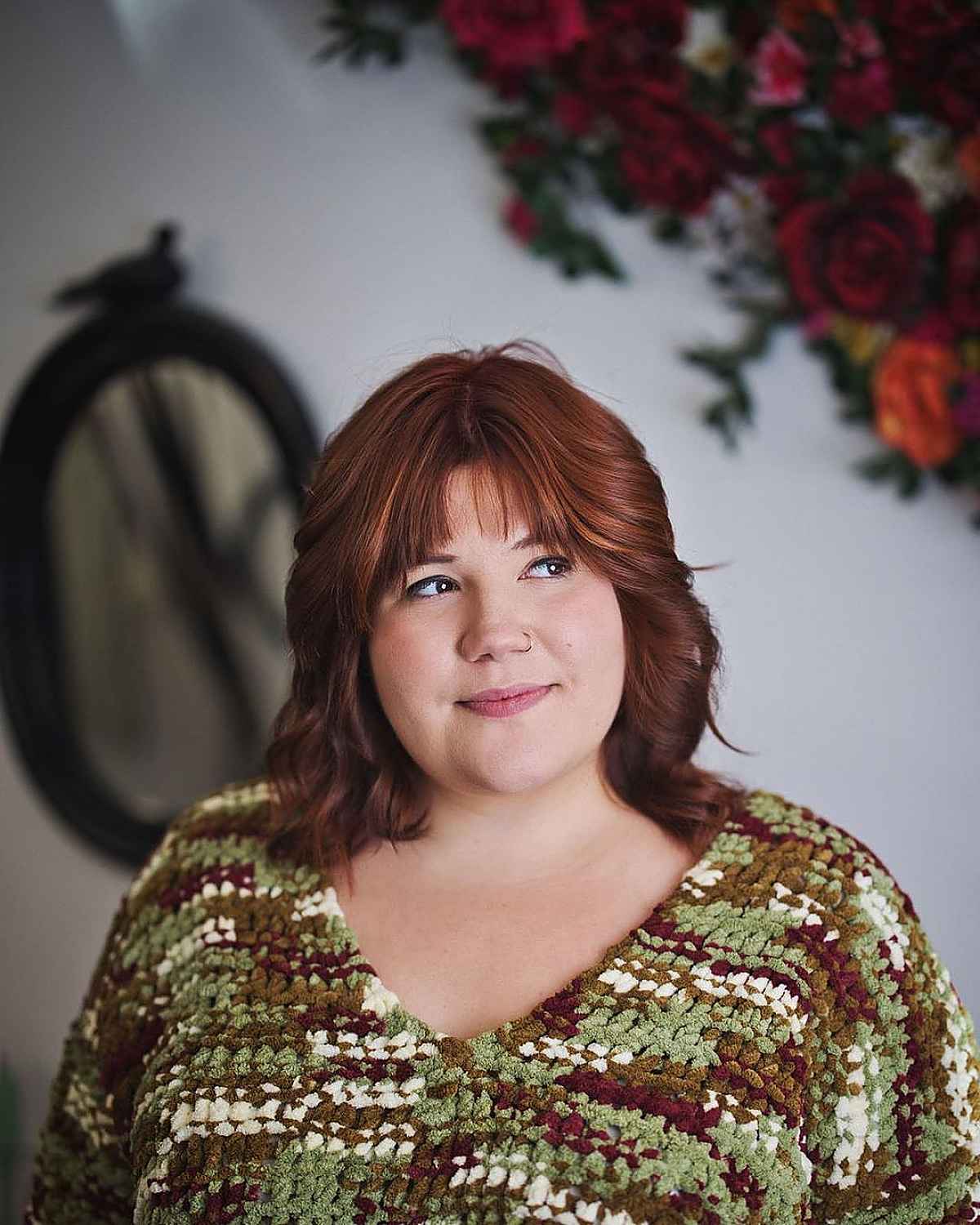 auburn feathered curls with bangs