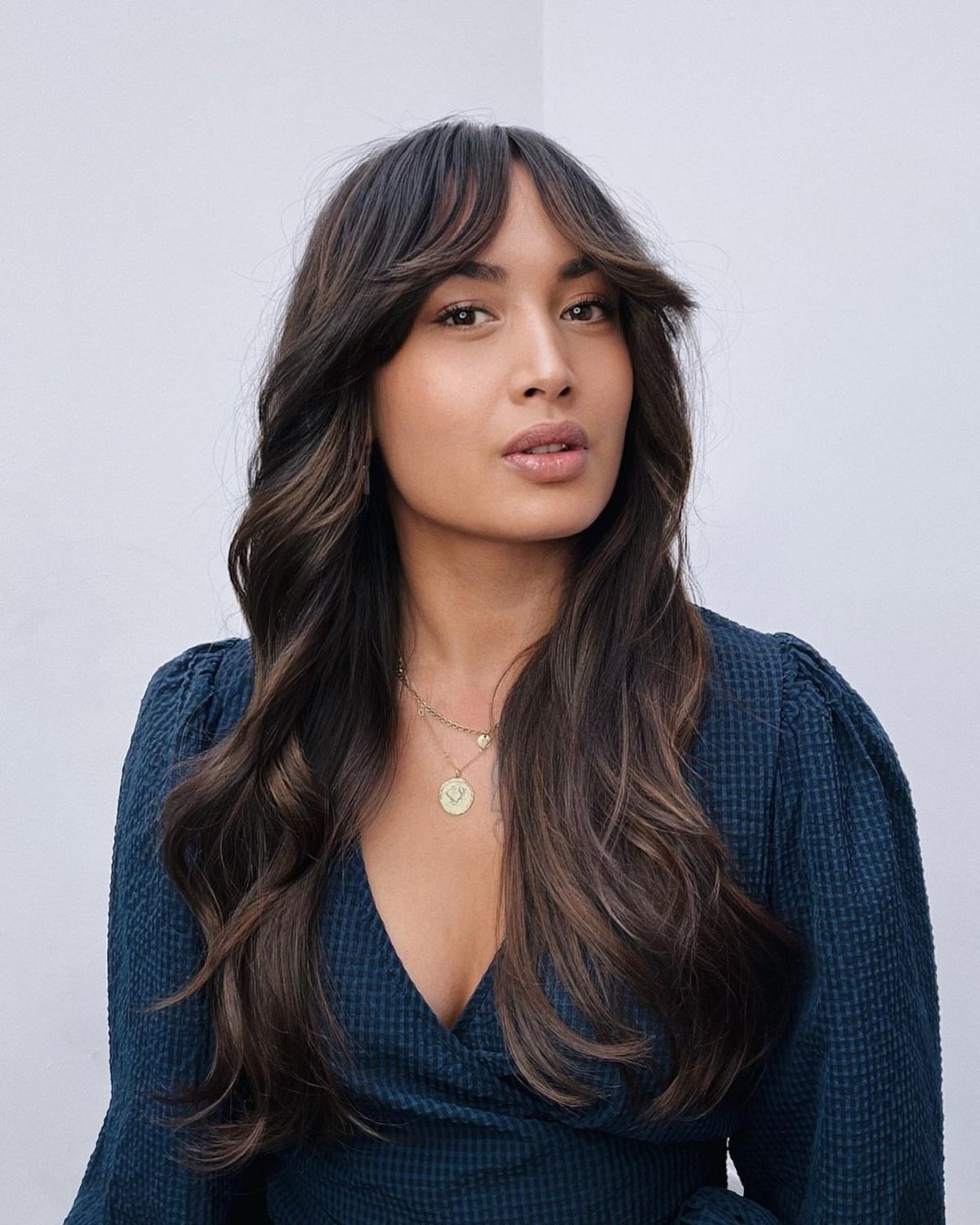 Chic Curtain bangs for wavy hair