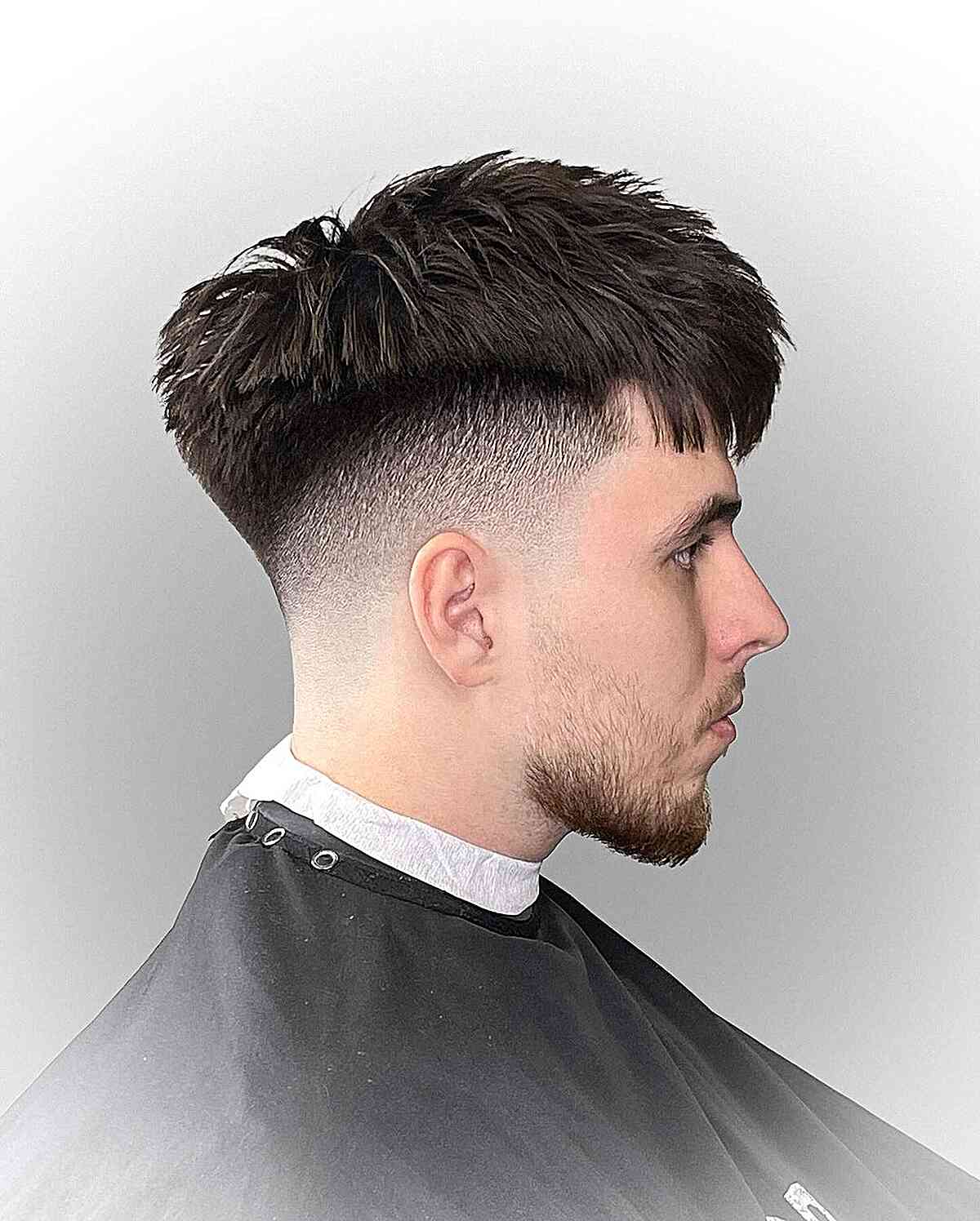 Dapper Fade Cut with Textured Bangs for Men