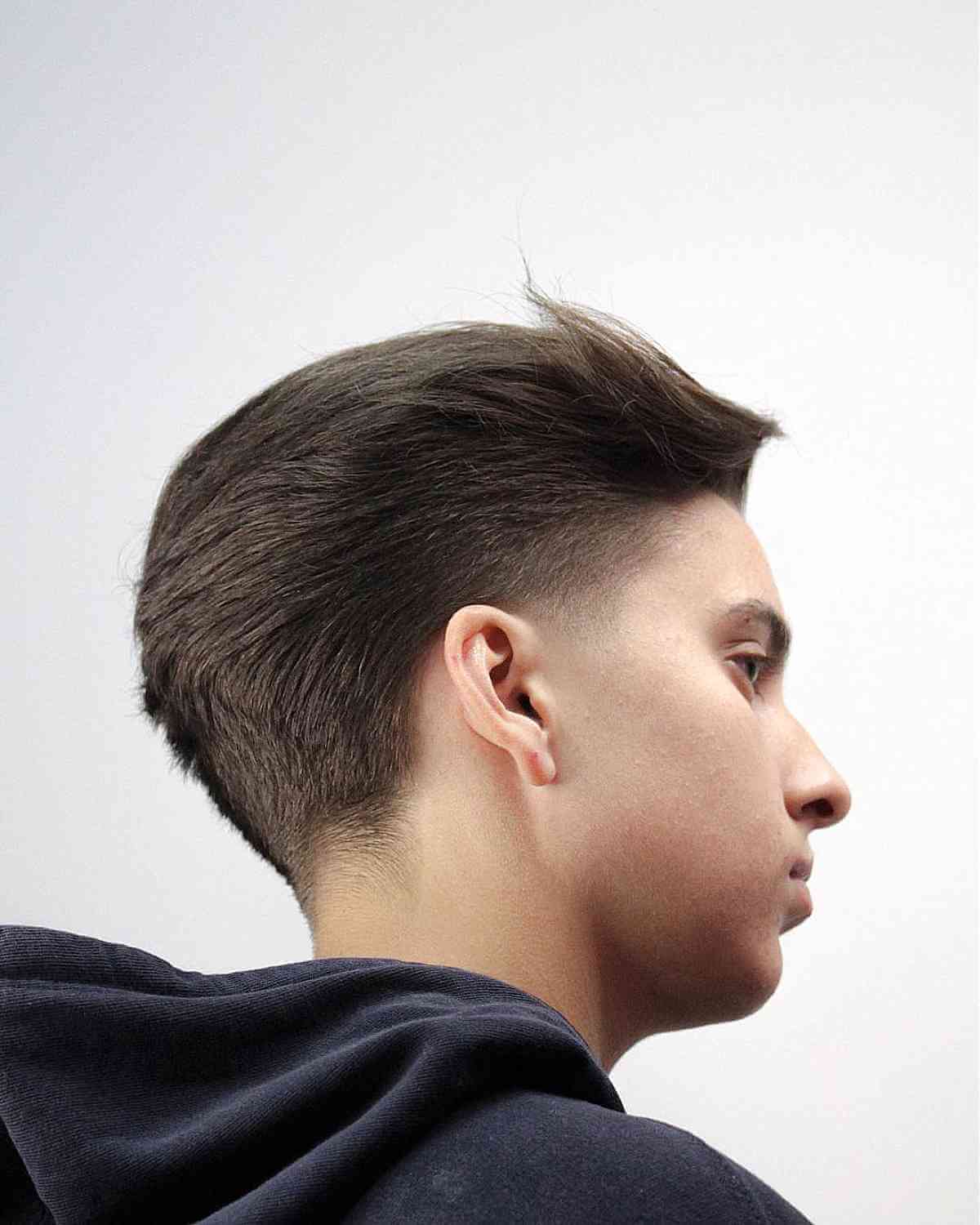 Dapper Slicked-Back Fade for Teen Boys