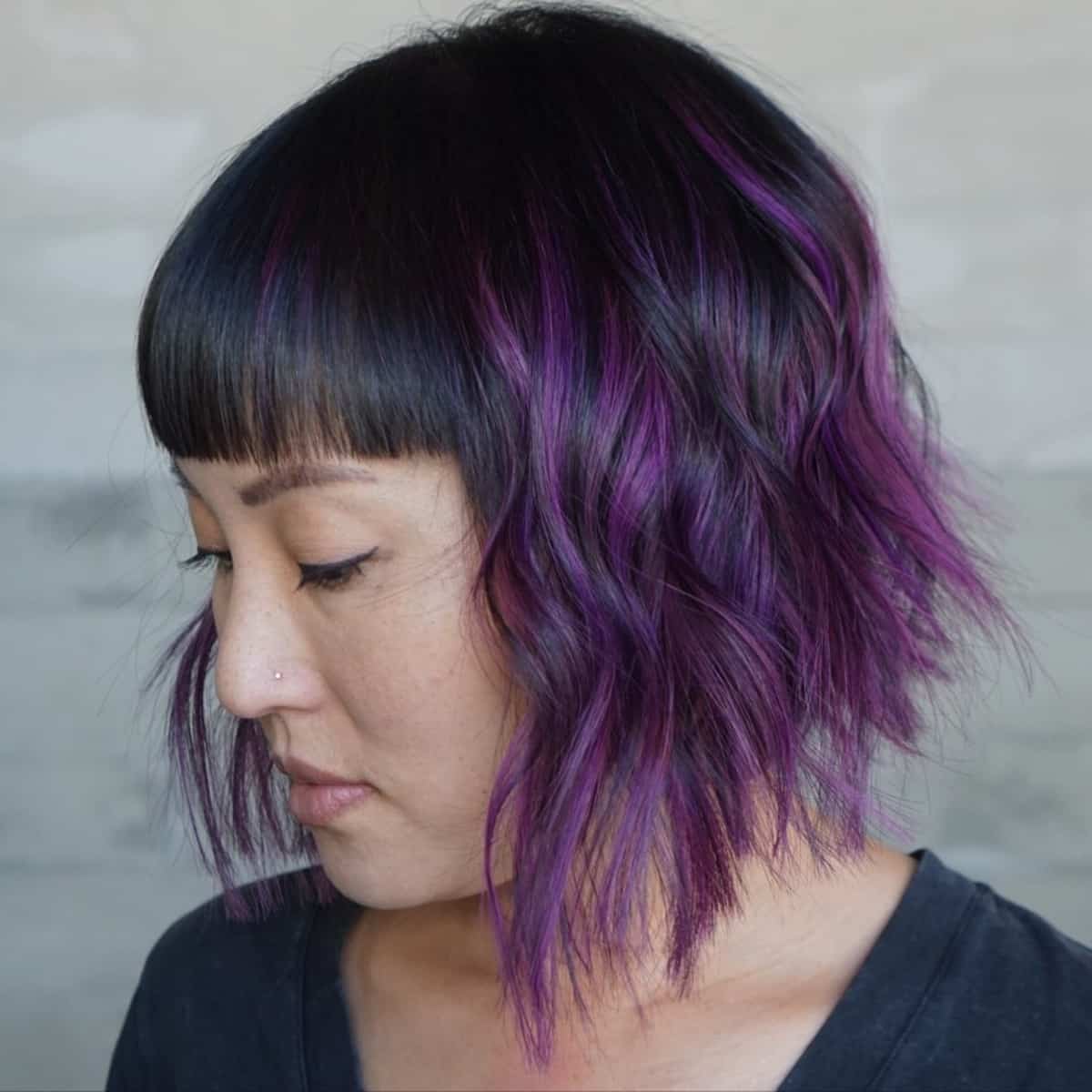 Bold inverted bob cut with purple ombre