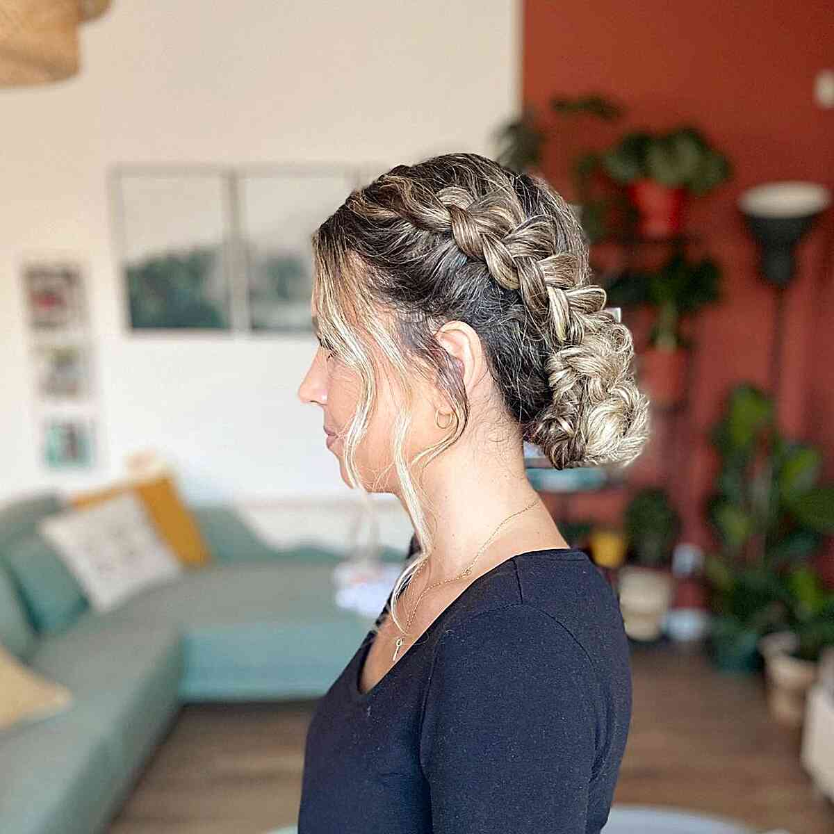 Low Dutch Braid Bun with Face-Framing Layers