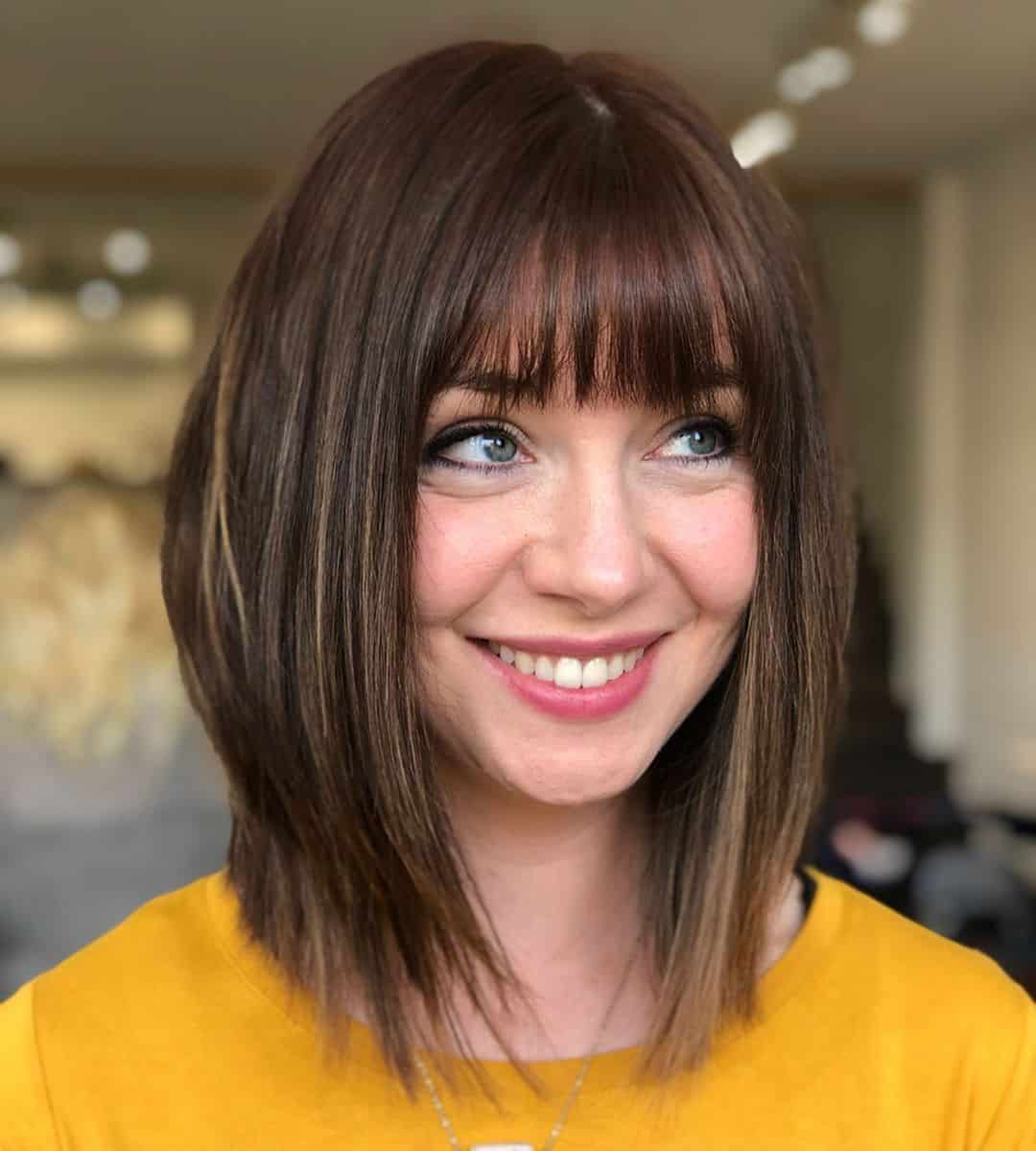 Fuller Medium-Length Haircut with Bangs for Thick Hair