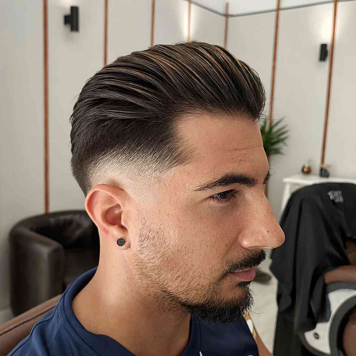 Medium-Length Slight Skin Fade Slicked Back Haircut for Men