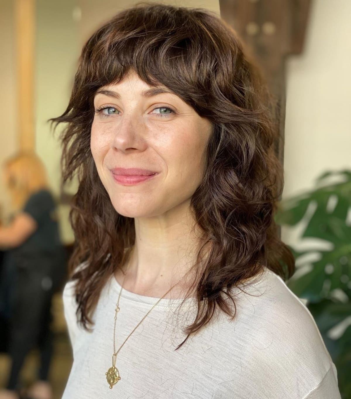 Dark Brown Shaggy Layers with Thick Bangs