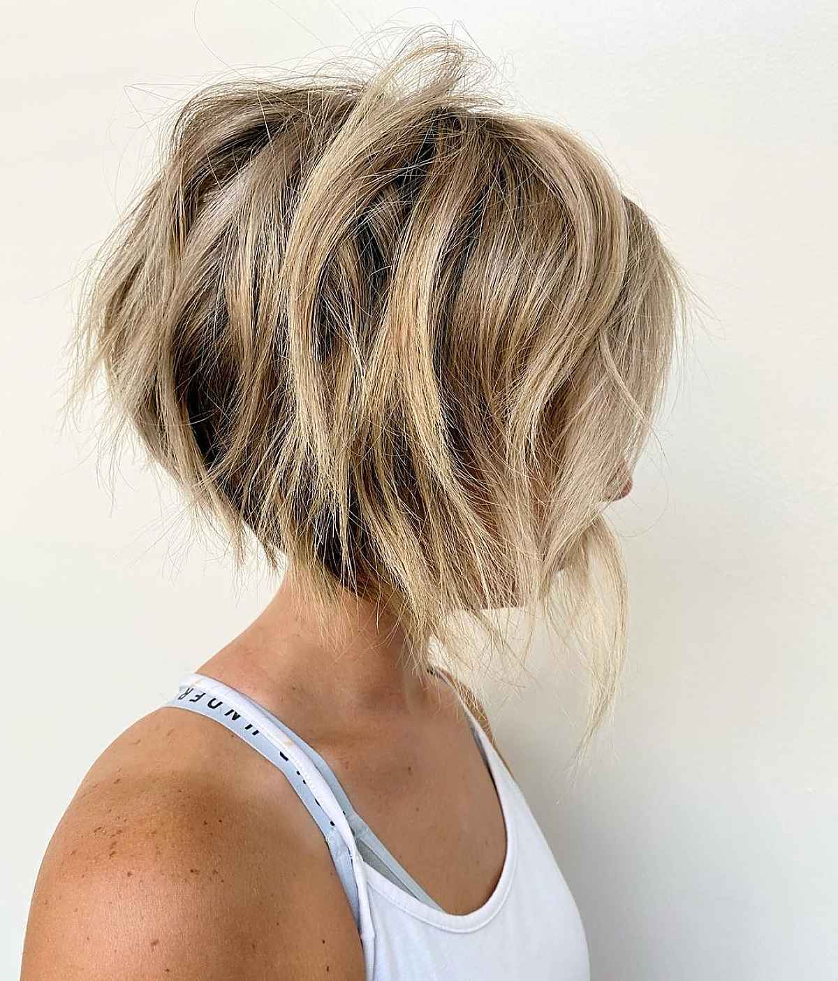 Short shaggy stacked bob with loose waves