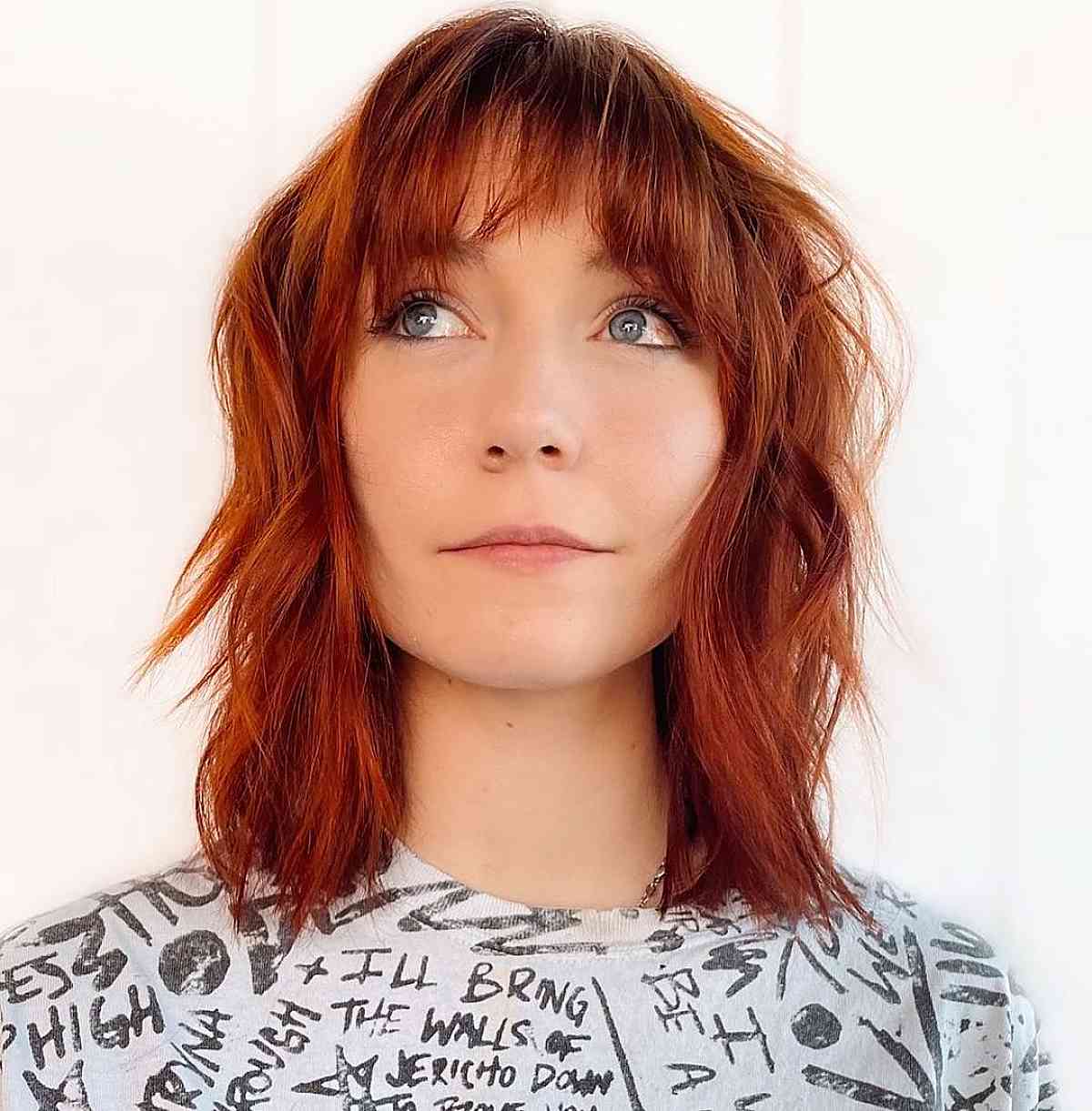 Shoulder-length red shag haircut