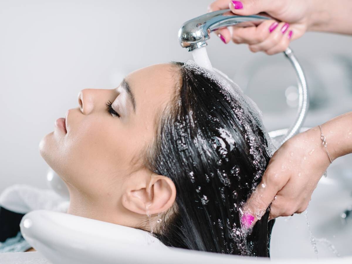 Someone having their hair washed at the salon