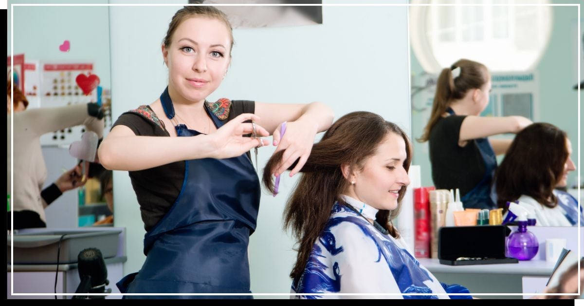 Someone with medium-length hair getting a haircut