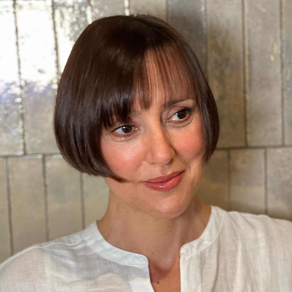 Symmetrical Ear-Length French Bob with Wispy Bangs