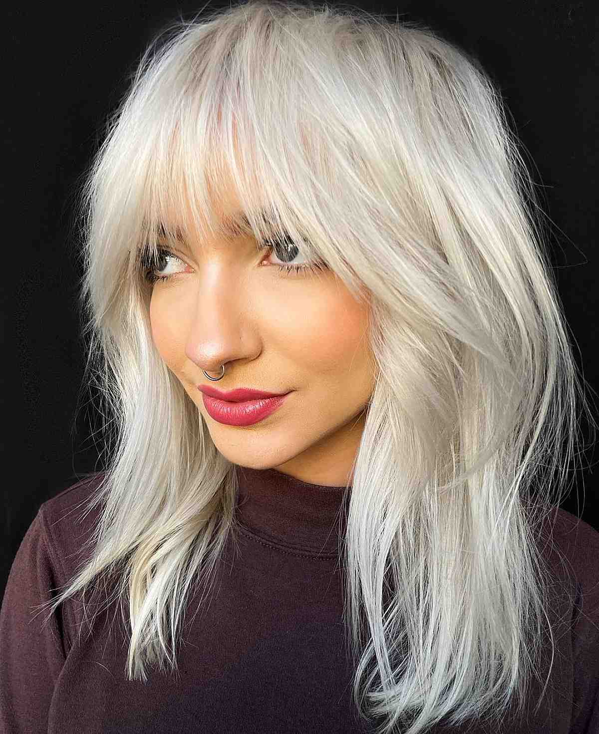 white blonde wispy shag with choppy bangs