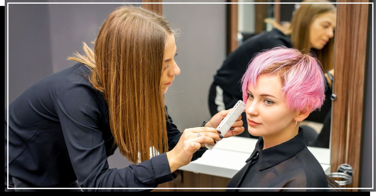 Woman with pixie hair consulting a stylist